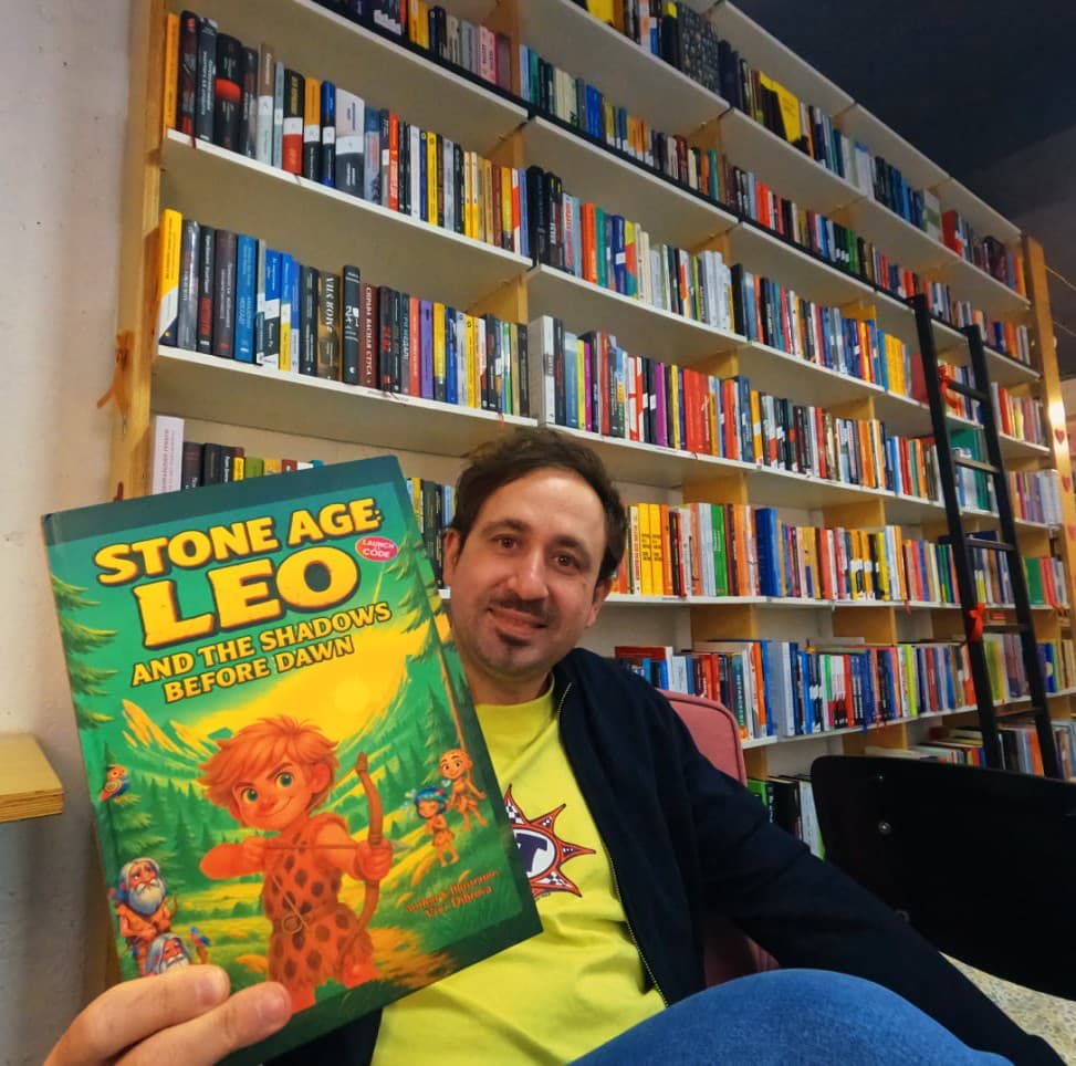 Vivi Dibrova holding Stone Age: Leo in a library